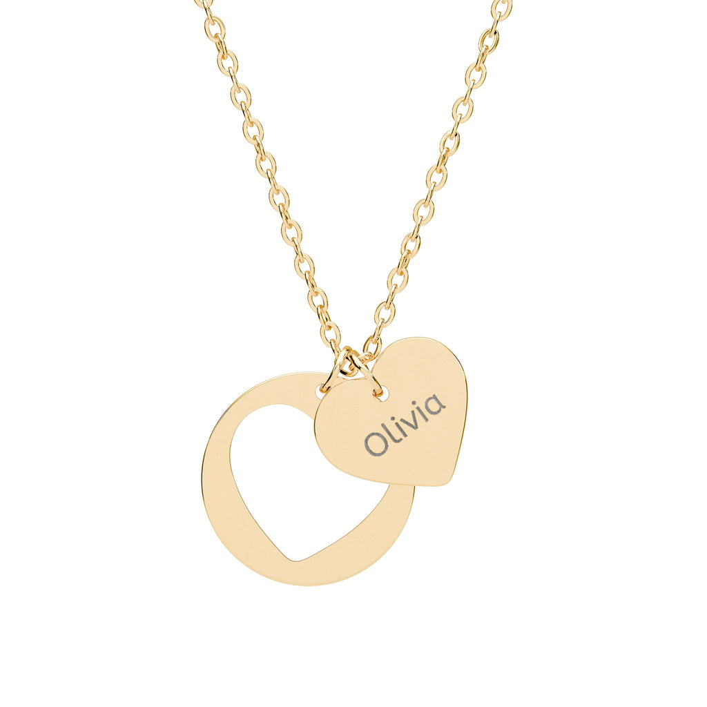 Gold necklace with a heart-shaped pendant and 'Faith' engraving on a white background