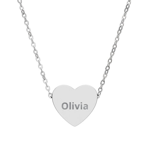 Heart-shaped pendant with engraved text on a silver chain against a white background
